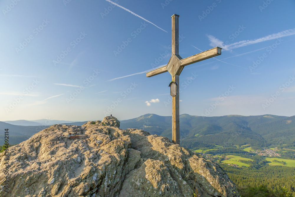 Wooden cross on the summit of a mountain Grosser Osser in National park Bavarian forest, Germany.
