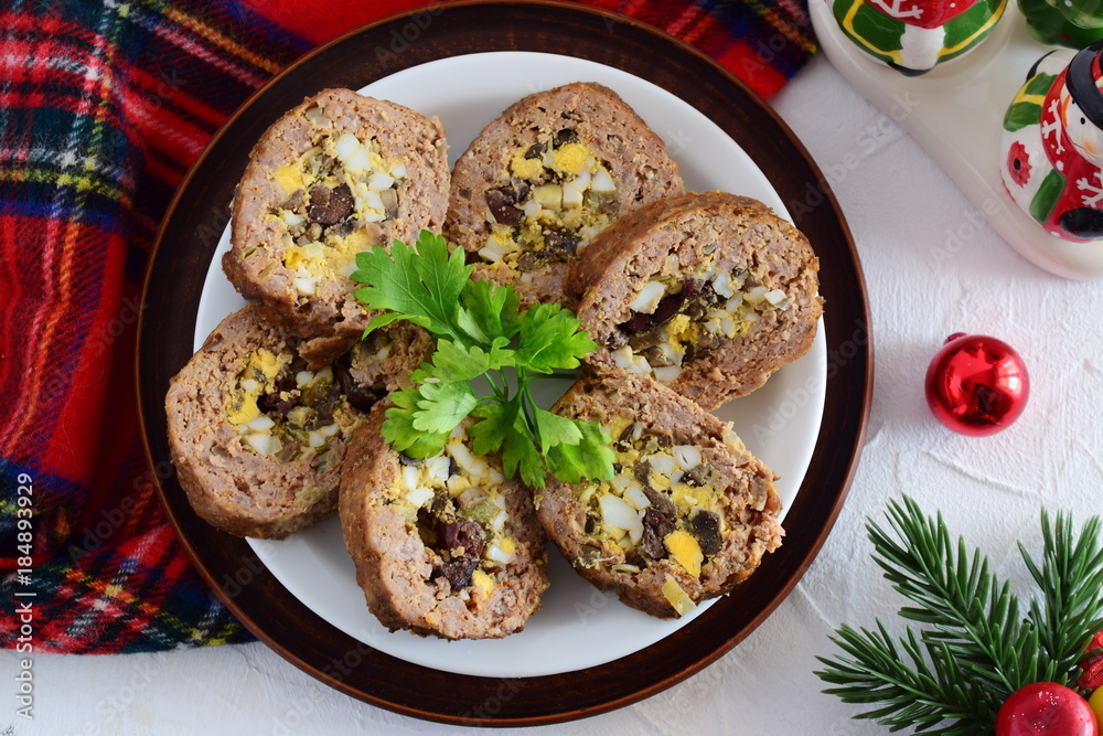 Meat roll stuffed with eggs, olives, sundried tomatos. Meat roll stuffed with eggs, olives, sundried tomatos.