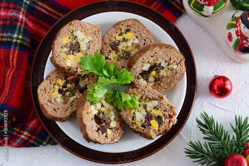 Meat roll stuffed with eggs, olives, sundried tomatos.