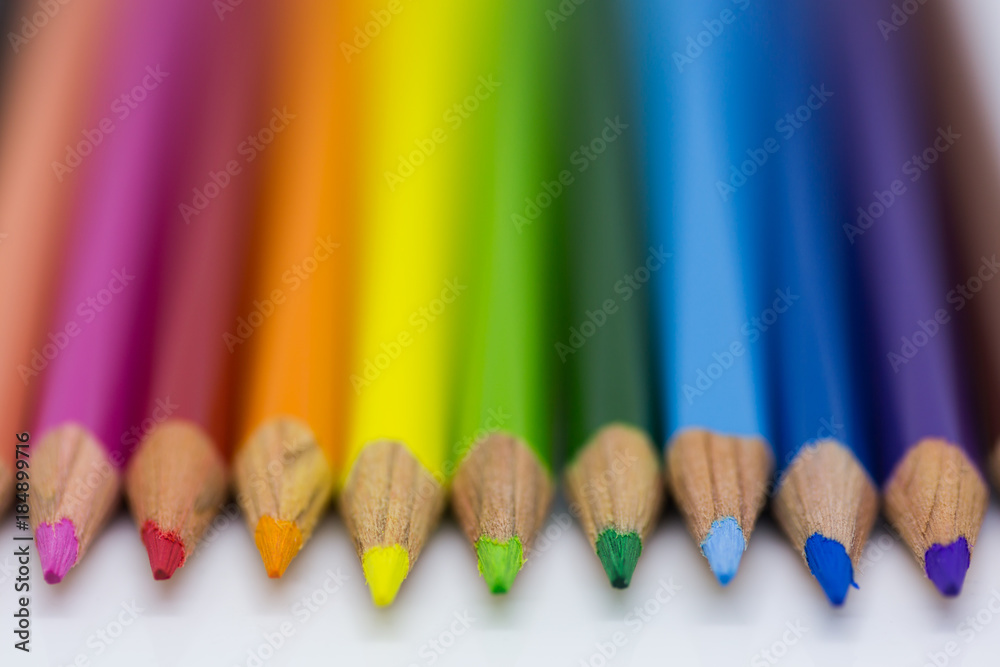 Colour Pencils layed out ona white backgrund Colour Pencils layed out ona white backgrund