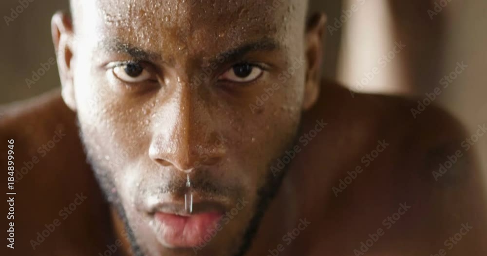  00:14 | 00:17 1×  A muscular and sweaty man is training at the gym by lifting the gym weights to strengthen his muscles. Concept of: workout, workout, power, supplements, fitness