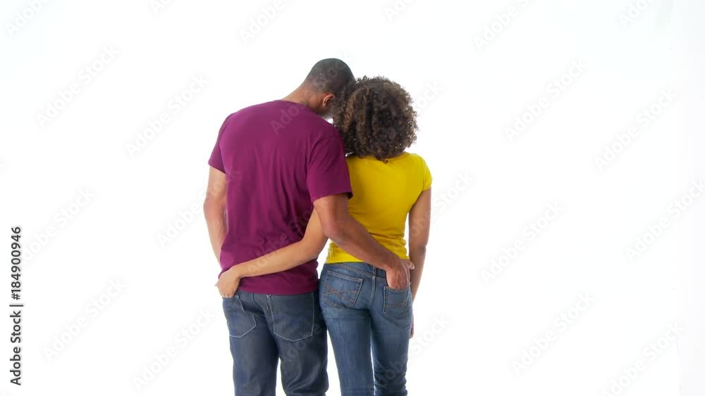 Back of African-American couple holding each other and holding hands Back of African-American couple holding each other and holding hands
