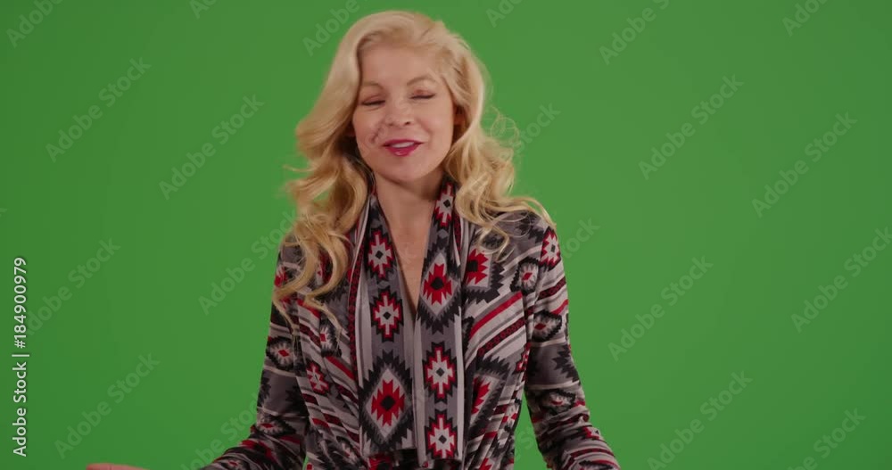Portrait of beautiful Caucasian woman dressed casually smiling at camera on green screen. On green screen to be keyed or composited. Portrait of beautiful Caucasian woman dressed casually smiling at camera on green screen. On green screen to be keyed or composited.