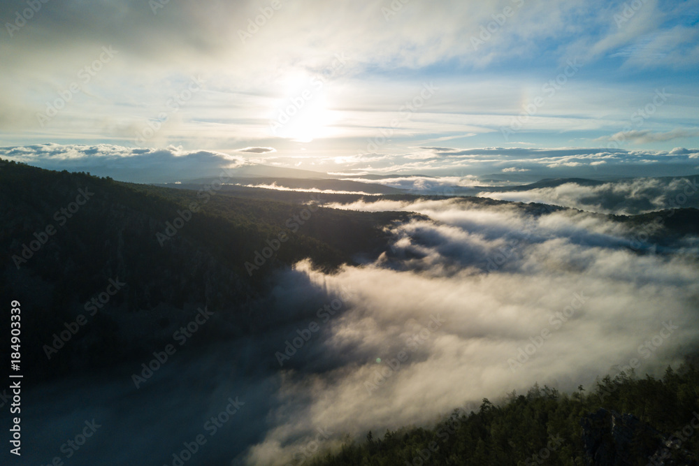 Sunset in the Ural mountains in Karatash ridge. Flying by drone