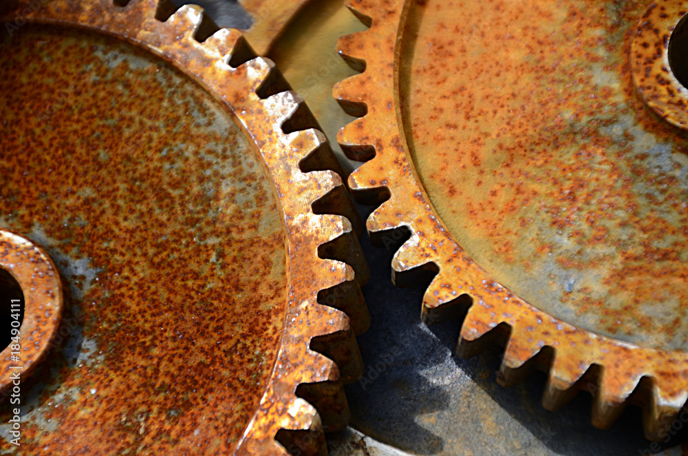 Cogs. Old cogwheels, is no longer in use, rust on the surface.