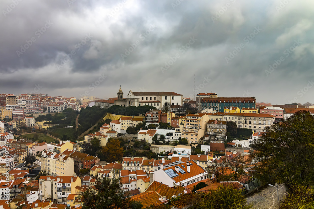 Panoramic view of Lisbon, Portugal in a raining and misty day