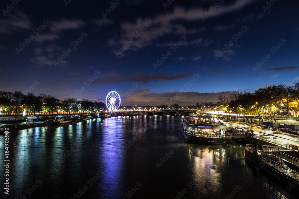 Fototapeta premium Beautiful Dusk over looking The Pont Alexandre III and Ferris Wheel from Pont des Invalides in Paris.