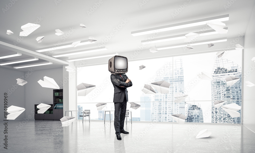 Businessman with an old TV instead of head.