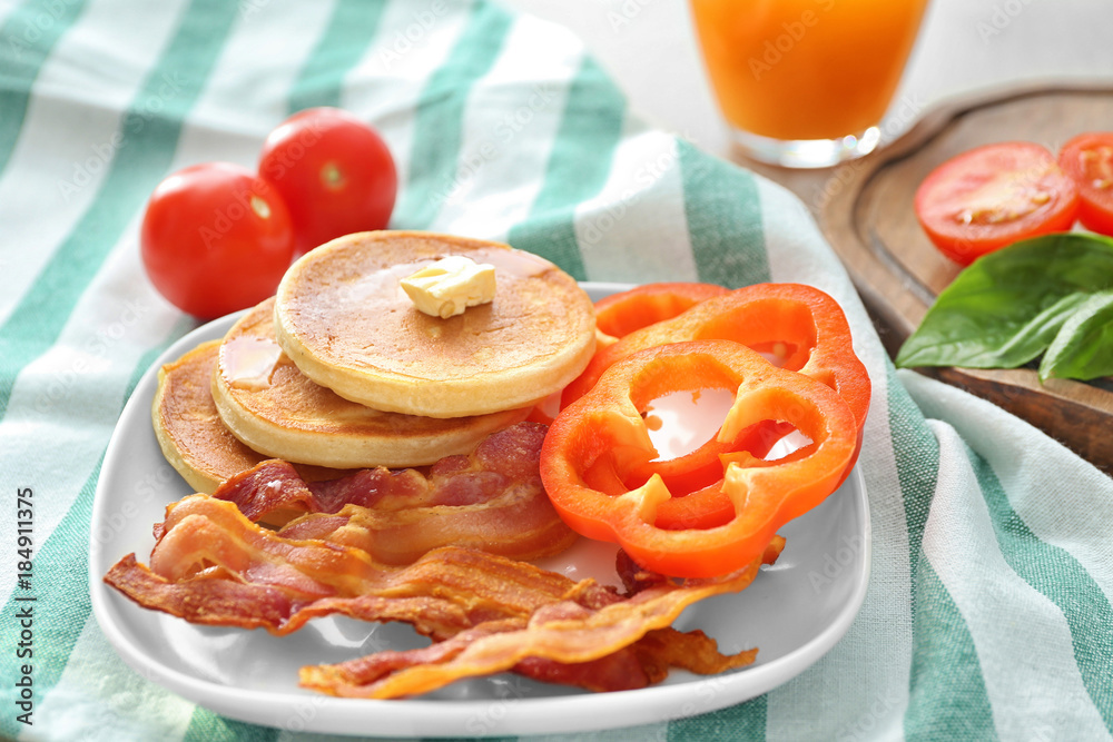Tasty breakfast with pancakes and bacon on plate Tasty breakfast with pancakes and bacon on plate