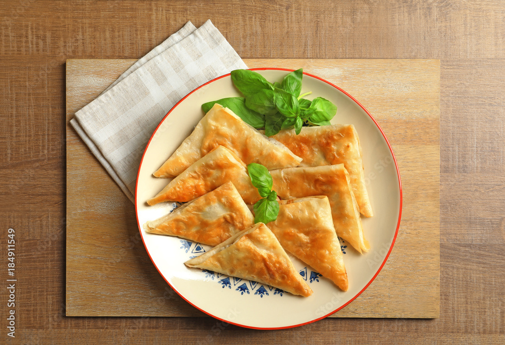 Plate with delicious samosas on table Plate with delicious samosas on table