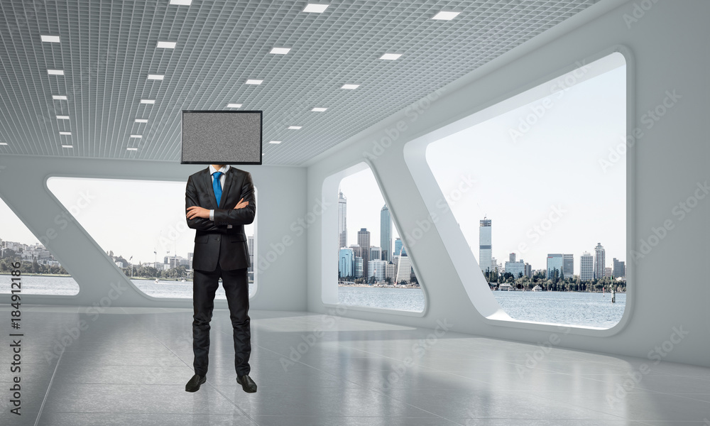 Fototapeta premium Businessman with TV instead of head.