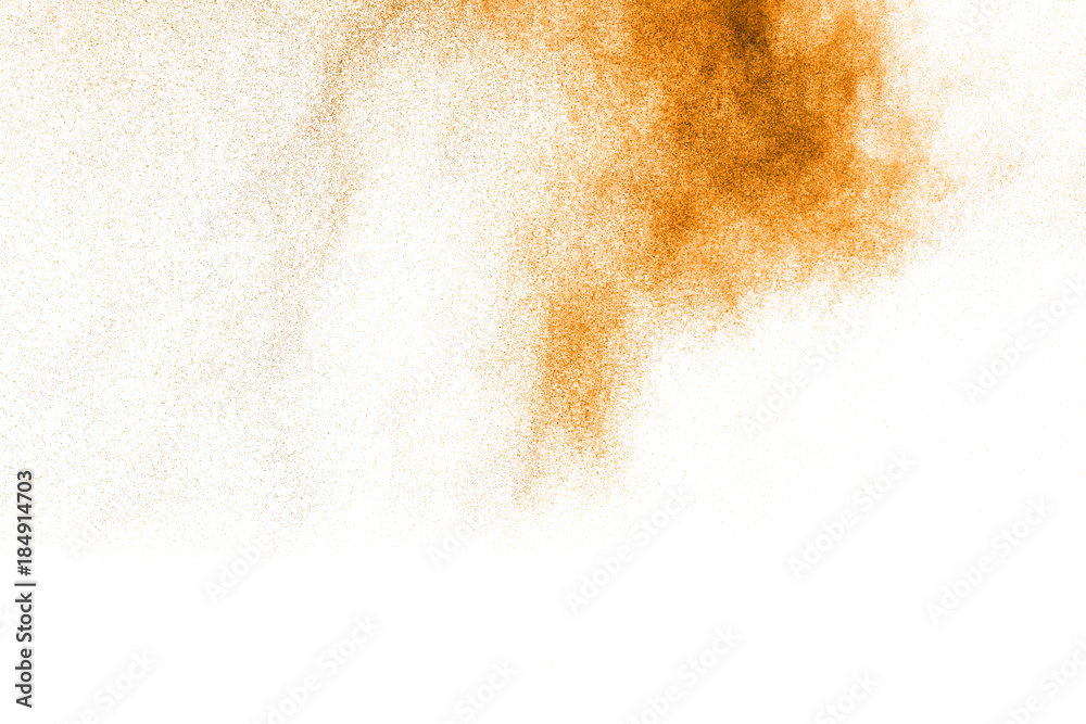 Fototapeta premium abstract orange dust explosion on white background. abstract orange powder splattered on white background, Freeze motion of orange powder splash.