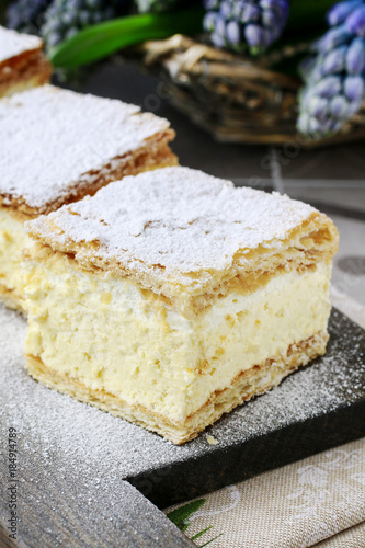 A Polish cream pie made of two layers of puff pastry  filled with whipped cream.