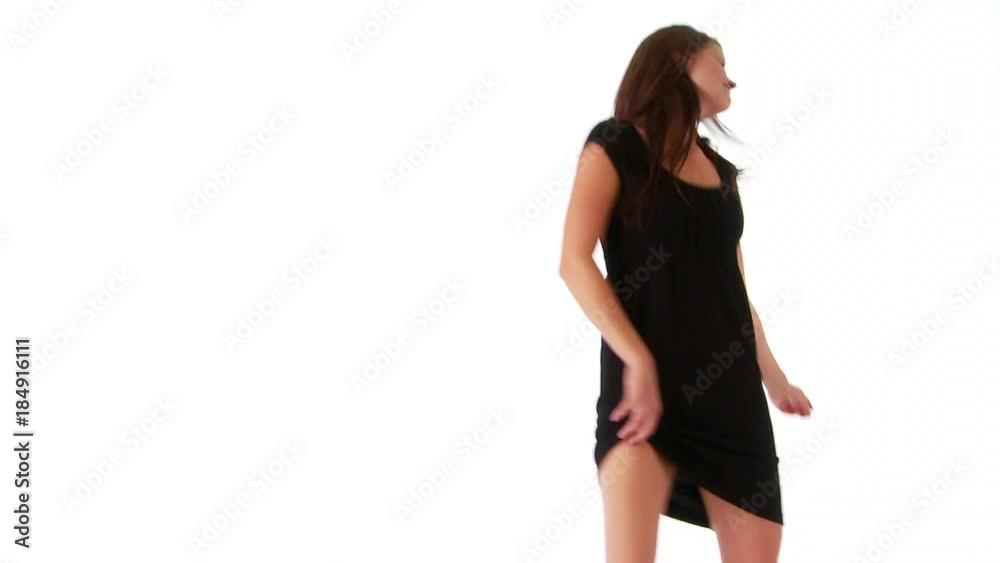 Young woman dancing on white background Young woman dancing on white background