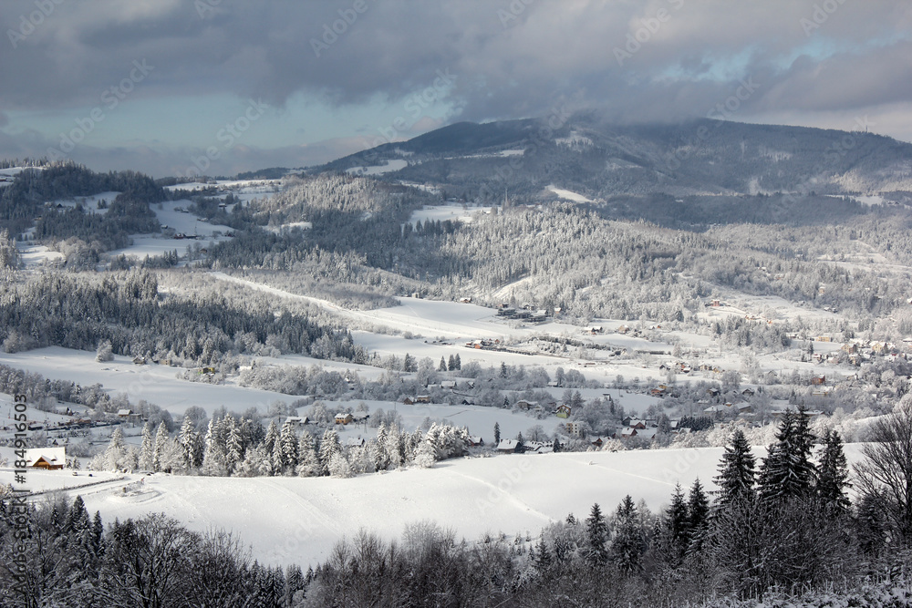  Panorama of mountain village in winter sun and snow