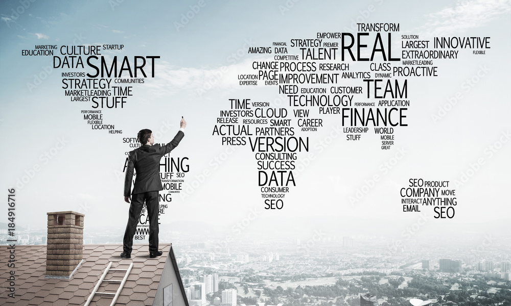 Businessman on brick roof draw world map as concept of globaliza Businessman on brick roof draw world map as concept of globaliza