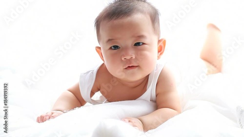 lovely asian baby girl in bed