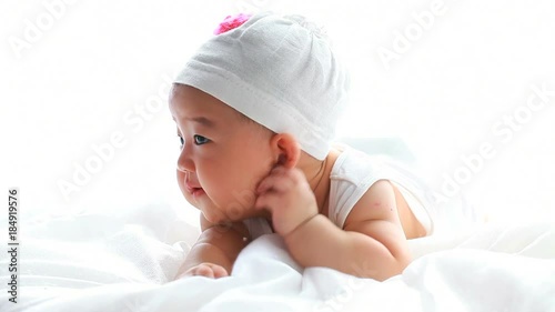lovely asian baby girl in bed
