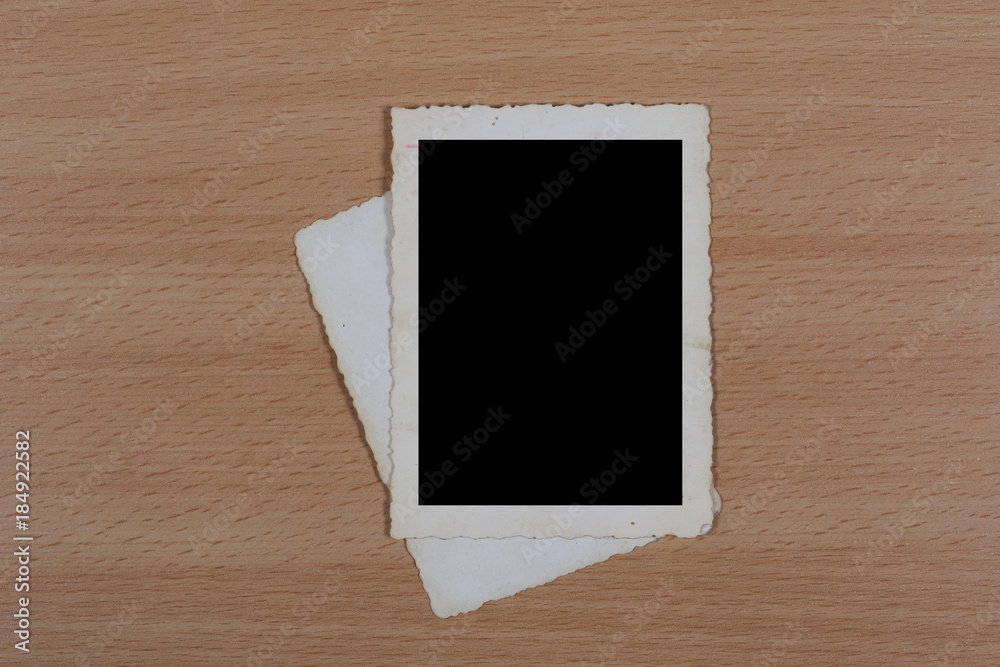 Blank old photo frame on plywood background Blank old photo frame on plywood background