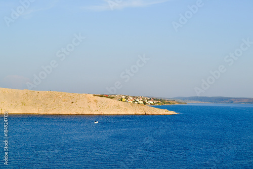 Sea and rocky shore blue sky sunny day