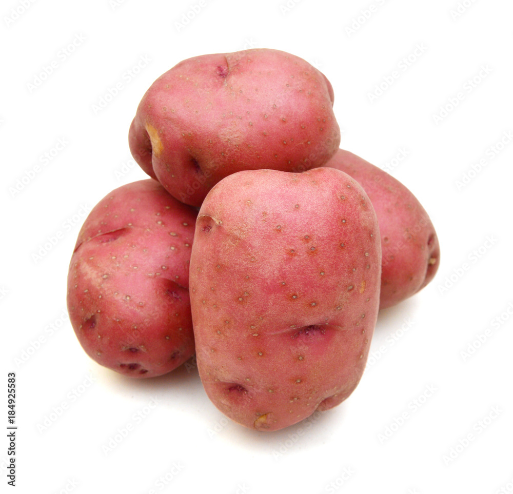 Close up of two red potatoes against white background. Close up of two red potatoes against white background.