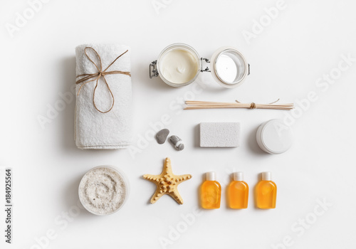 Spa and beauty threatment products on white paper background. Spa branding mock-up. Flat lay.