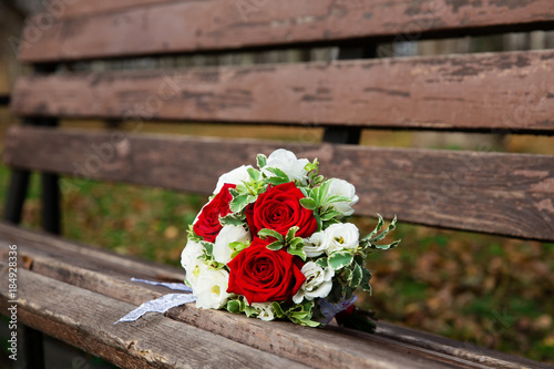 Beautiful wedding bouquet on the bench in the park © protivnica
