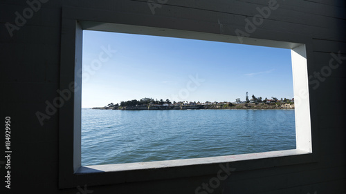 Pier window offers a frame for a view towards Santa Cruz waterfront.