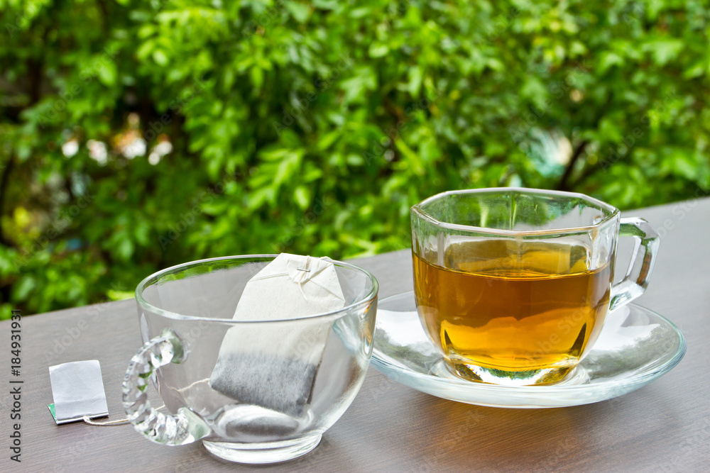 Two cups of tea on the table in the garden Two cups of tea on the table in the garden