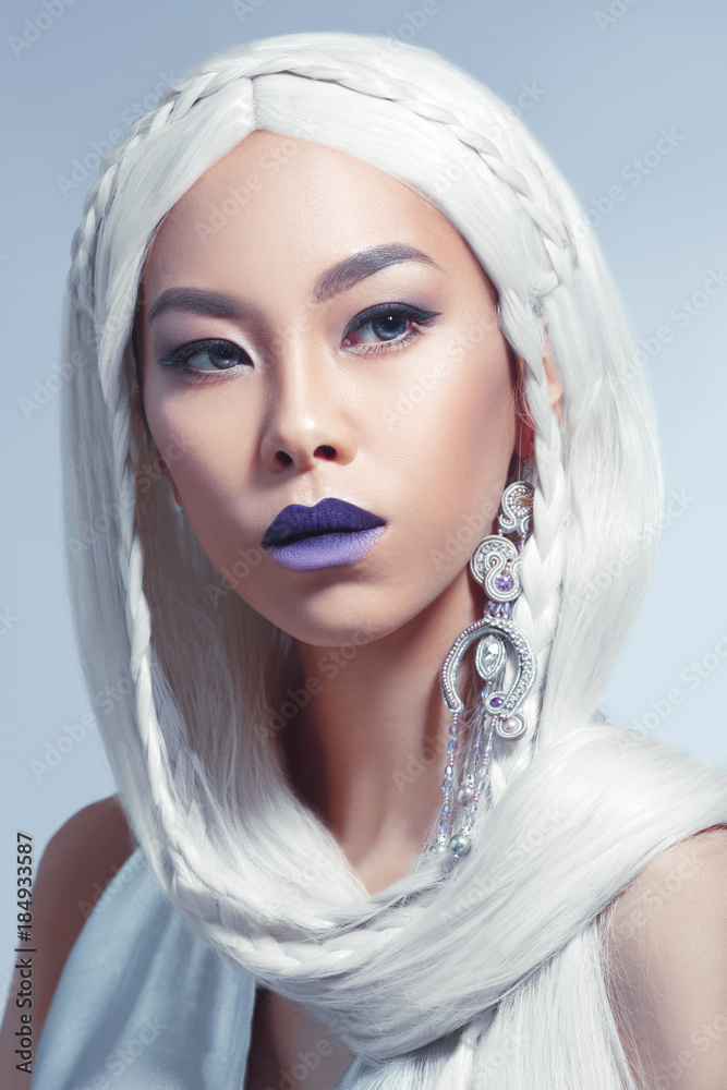 Beauty portrait of a beautiful Asian girl with long white hair isolated ...