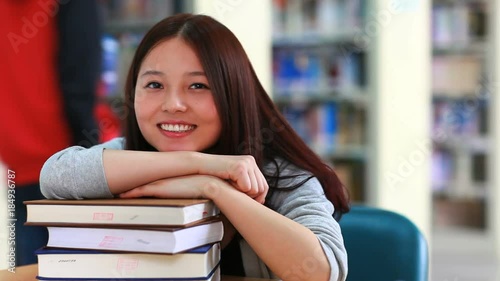 pretty female college student in library 