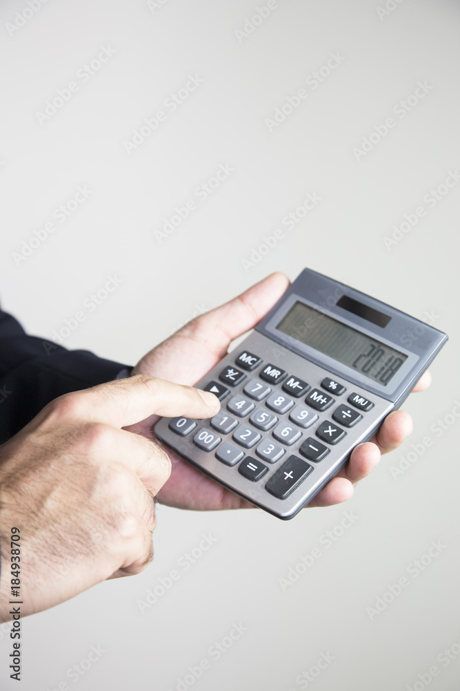 Business man hands working on calculator Business man hands working on calculator