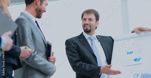 Mature man making a business presentation to a group