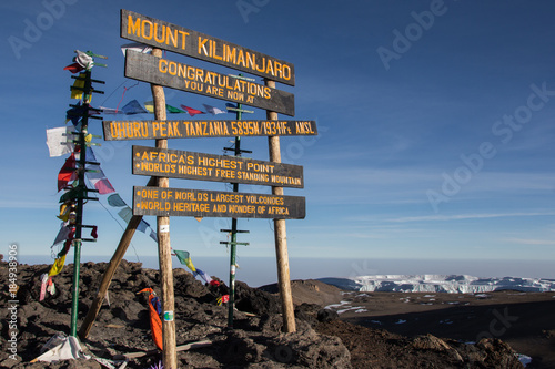 Sign on top of mount Kilimanjaro at Uhuru Peak in Tanzania photo