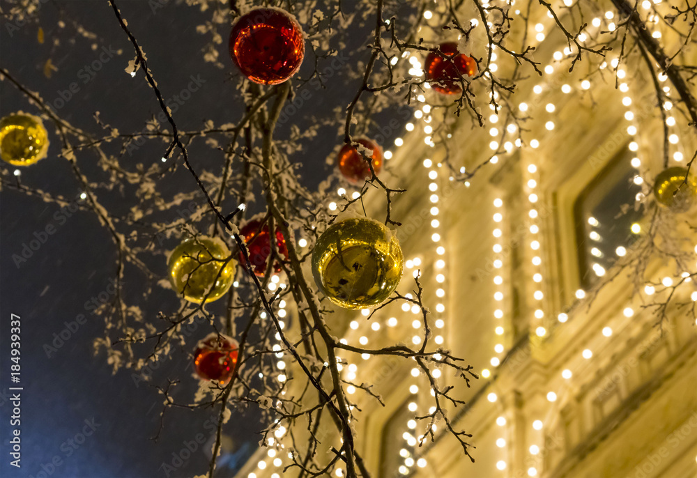 street festive decoration of the city for Christmas and new year bright shiny balls of golden red on trees