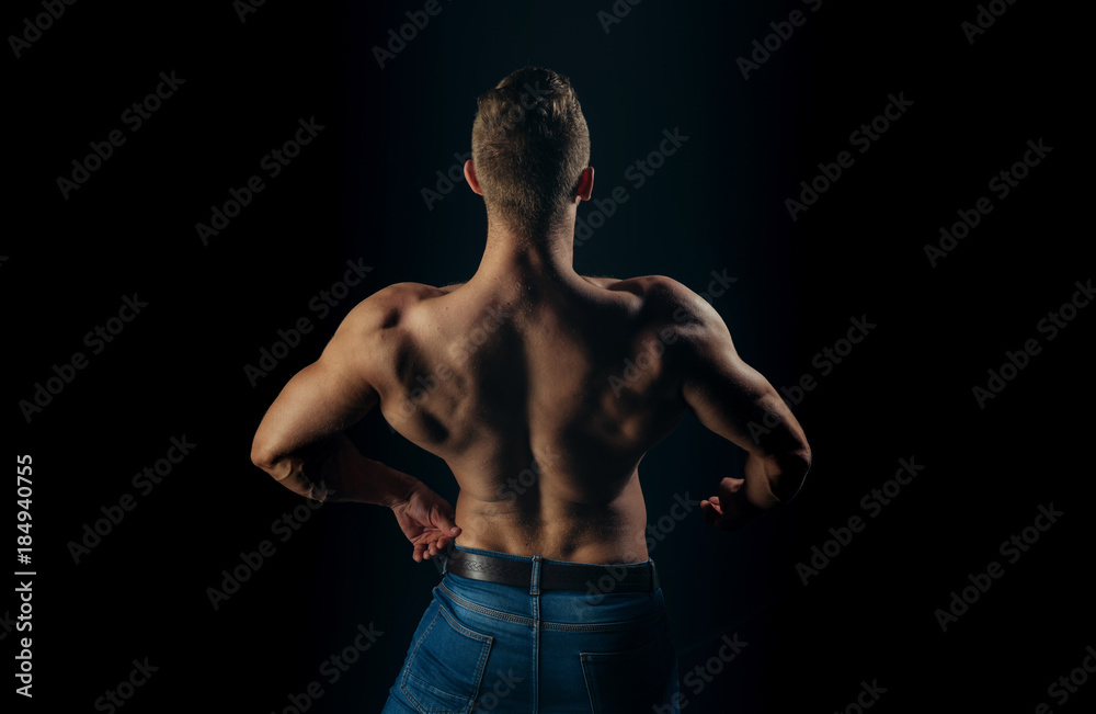 Bodybuilder man with muscular torso back