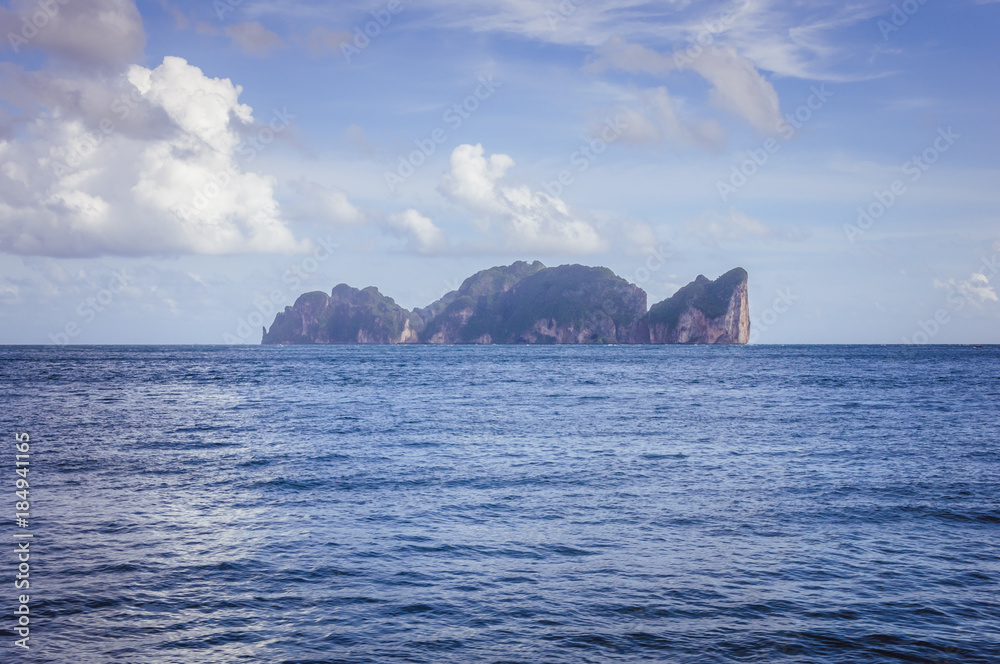 Small rocky island in the middle of the ocean Small rocky island in the middle of the ocean