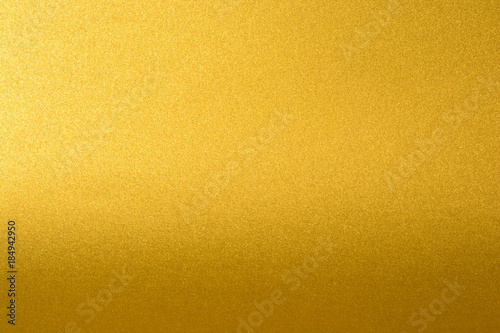 Details of golden texture background with gradient and shadow. Gold color paint wall. Luxury golden background and wallpaper. Gold foil or wrapping paper.