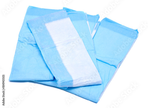 Foto Medium size blue under pads for adults isolated on white background