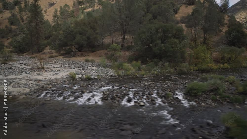 Driving plate side view of merced river from moving car Driving plate side view of merced river from moving car
