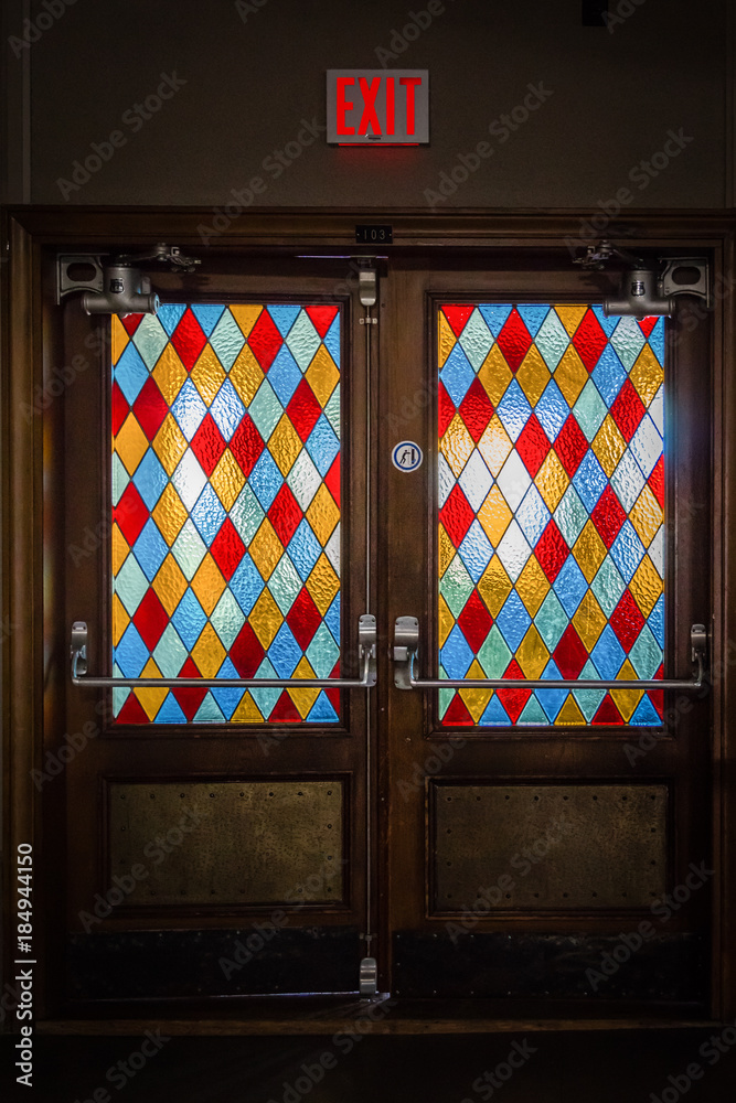 Vertical Image Of A Pair Of Old Wood Vintage Doors With Diamond Shaped Multicoloured Stained Glass Windows Stock Photo Adobe Stock