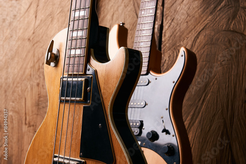 Wooden electric bass guitar and classic electric guitar