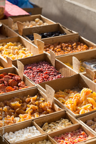 Different types of dried fruits for sale on a local market in France, Europe.