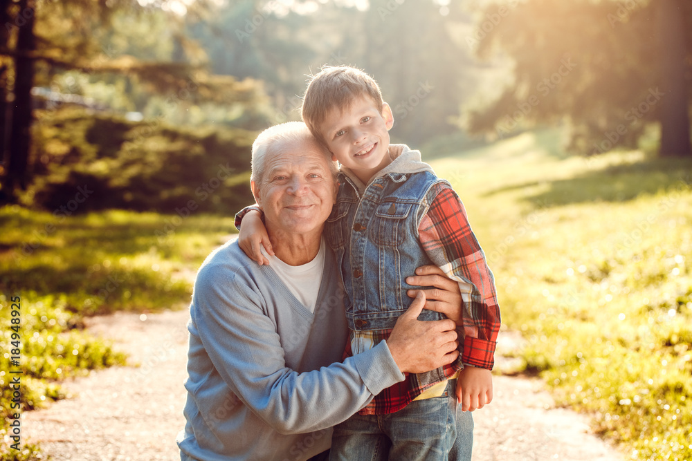 Grandfather and grandson together outdoors family concept Grandfather and grandson together outdoors family concept