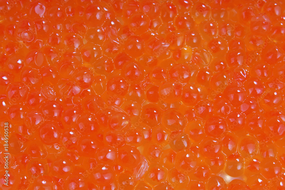 Red caviar studio photo. Caviar texture pattern background food closeup
