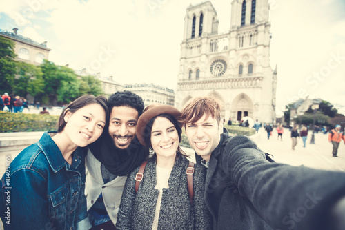 Multi-ethnic Group Of Friends Having Fun In Paris, Notre Dame