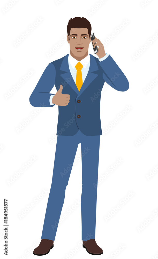 Businessman talking on the mobile phone and showing thumb up Businessman talking on the mobile phone and showing thumb up