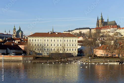 View on the winter Prague gothic Castle above River Vltava in the sunny Day, Czech Republic