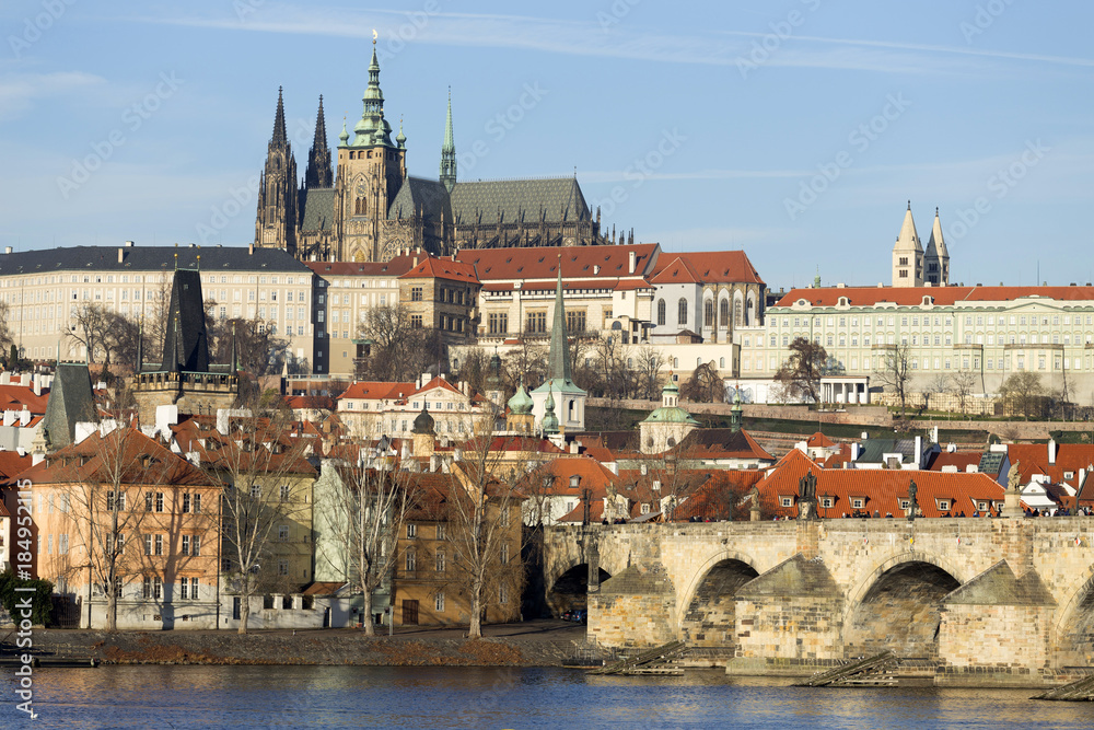 View on the winter Prague gothic Castle with the Charles Bridge in the sunny Day, Czech Republic