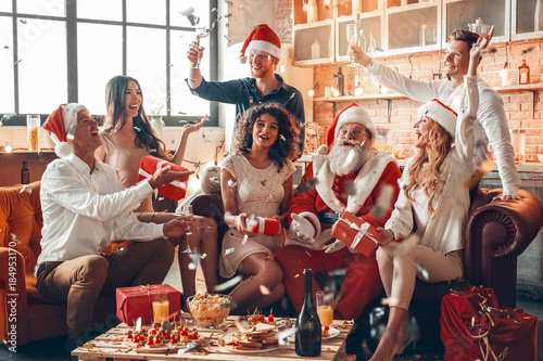 Group of friends party together indoors celebration